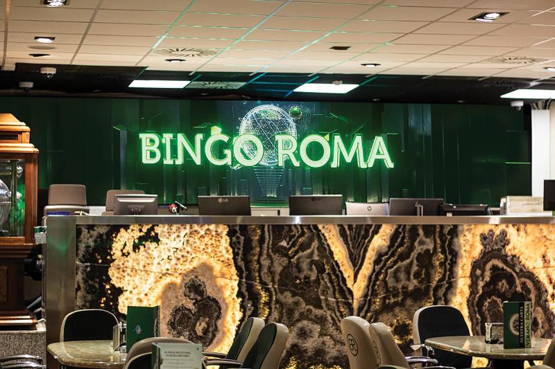 Bingo Roma room from the inside with big sign and seats in front.