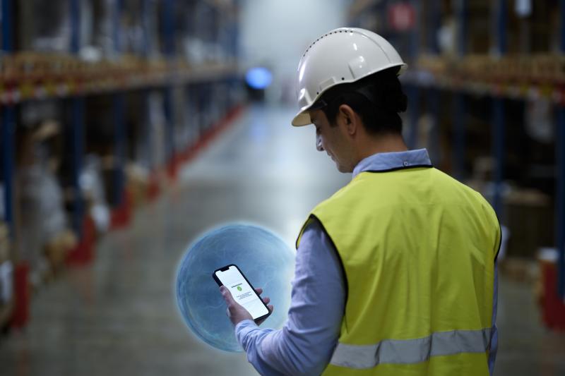 Cybersecurity axis warehouse person holding phone