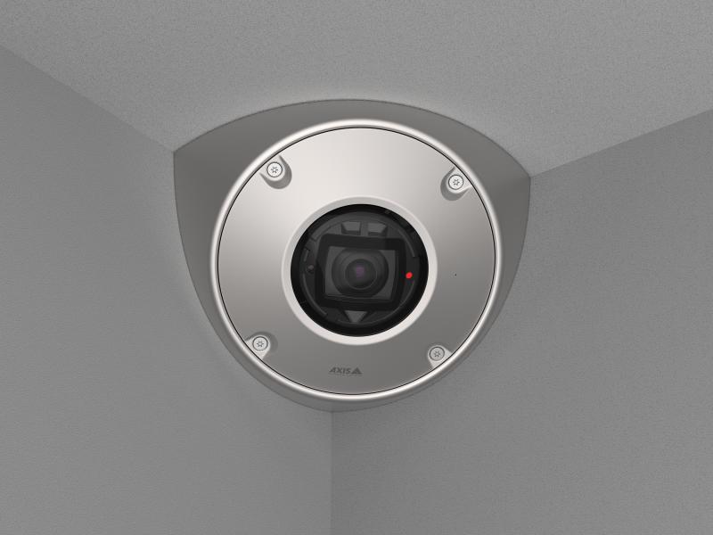 AXIS Q9216-SLV in stainless steel, mounted in a corner with gray walls