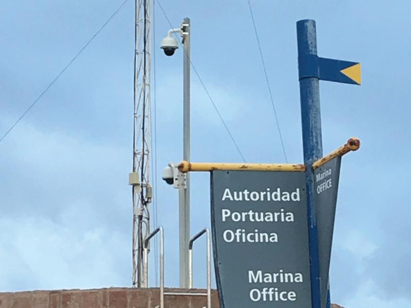 Pole camera and sign of marine office.