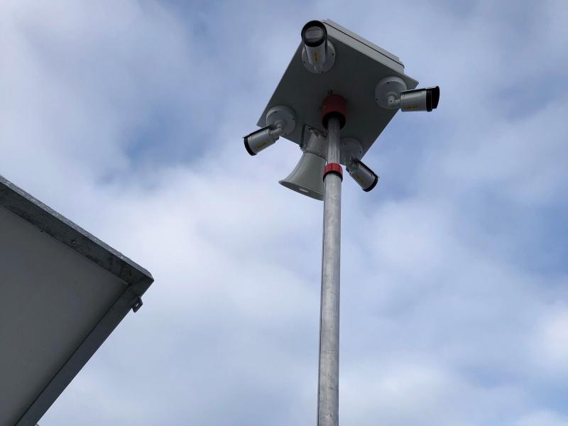 Axis Network Cameras on a pole in an outdoor environment.