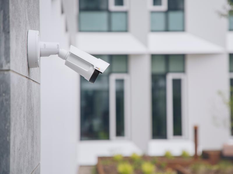 AXIS P1455-LE IP Camera mounted on a facade in an outdoor environment