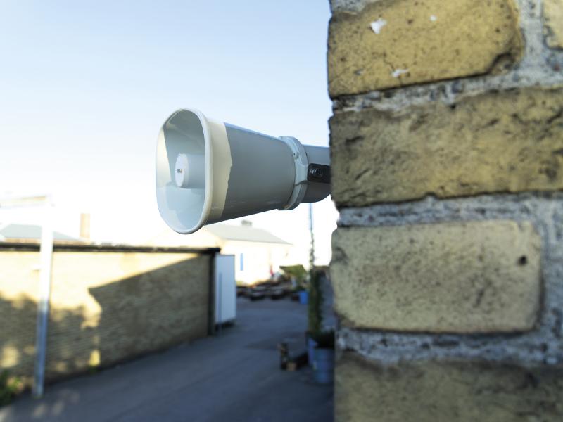 AXIS C3003 speaker mounted on the facade of a brewery