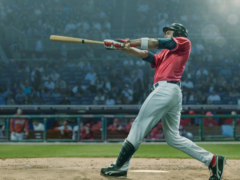 Baseball player hitting on a bat game
