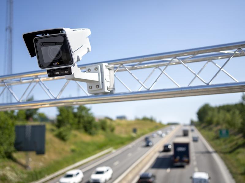Fixed box traffic camera overlooking highway traffic