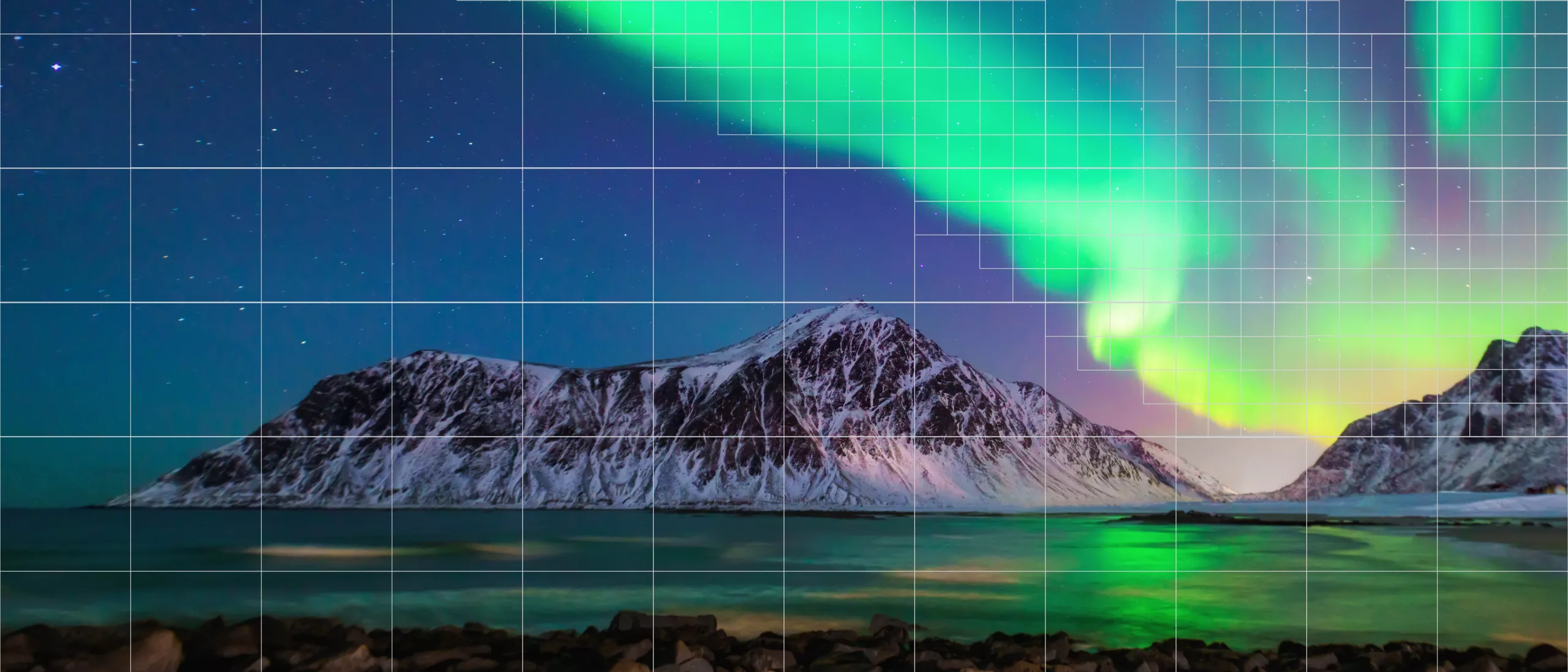 Big mountain by the sea under northern lights.