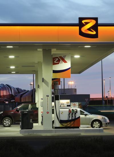 Gas station at night, named Z with orange colors.