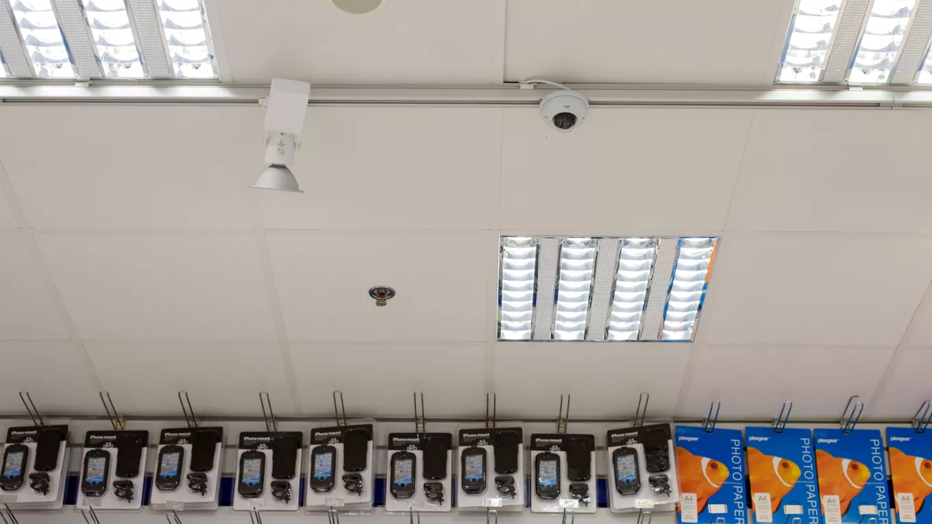 AXIS T91A33 Lighting Track Mount, mounted in a shop