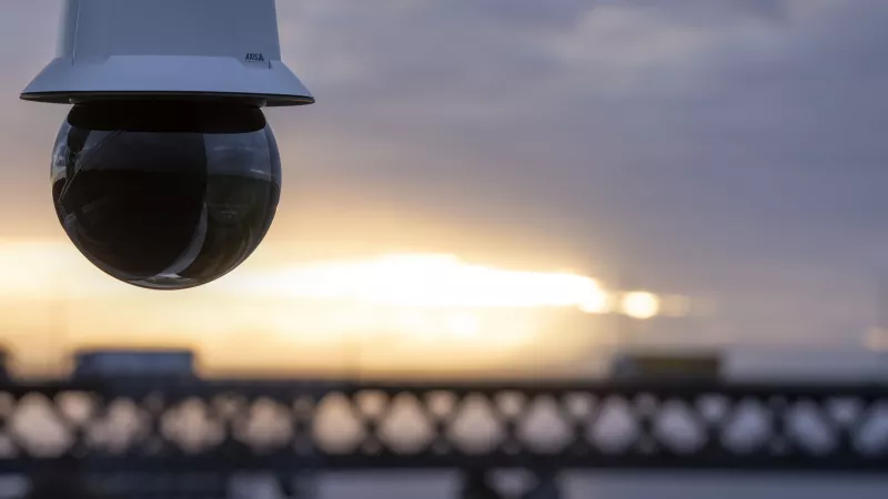 Camera overlooking sea and bridge