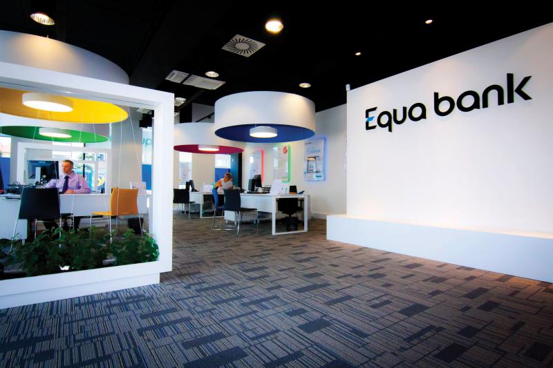 Inside of Equa bank, white walls and colorful lamps.