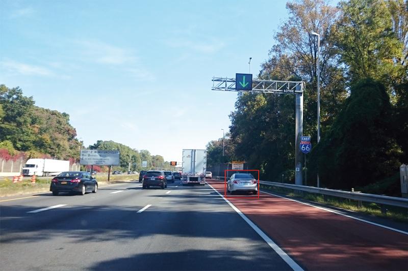 Screenshot of I-66 highway with red marked car in shoulder.
