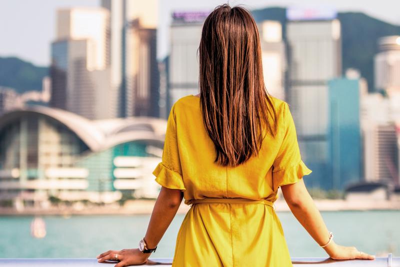 Woman looking out over a city