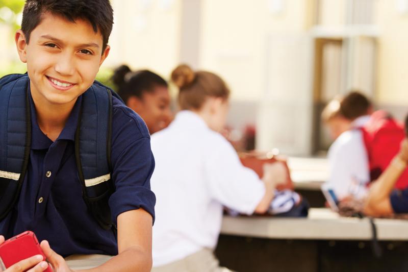 High school student with a phone