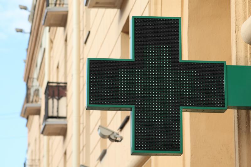 Pharmacy sign on a house facade