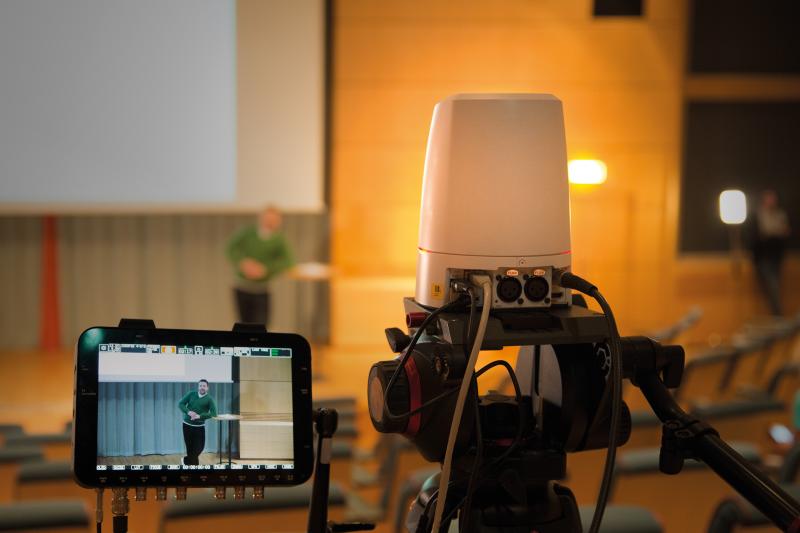 Closeup of a camera that record auditorium