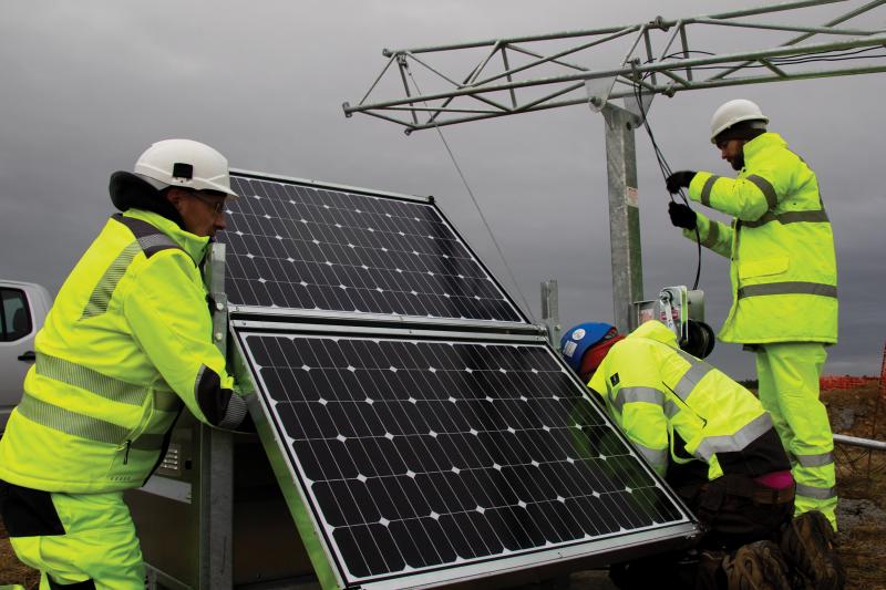 Men installing solar panel