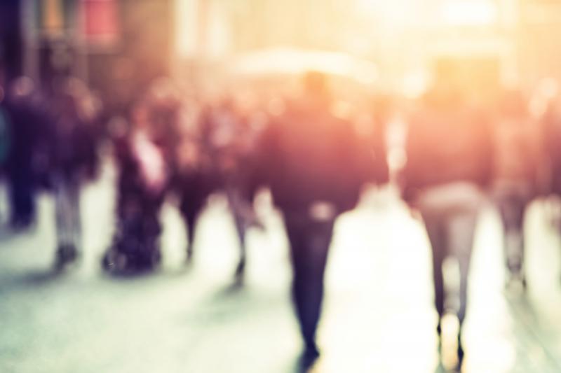 crowded area of people in blurred light