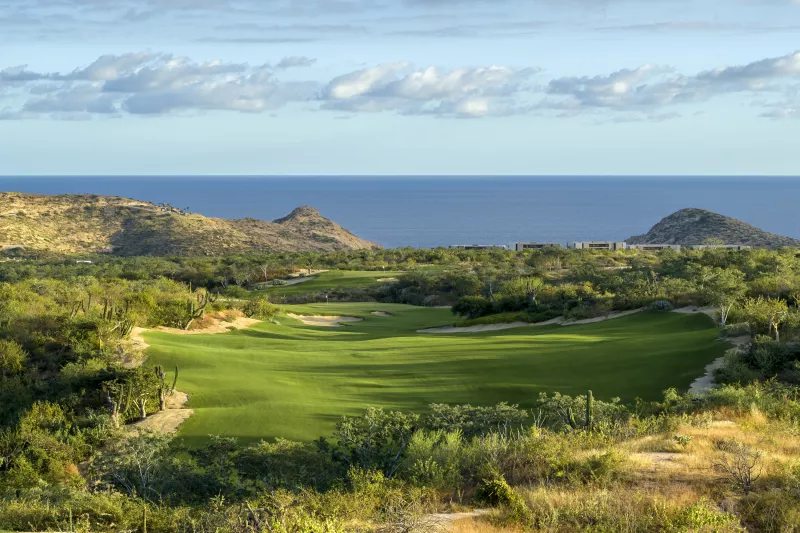 Wide shot of Twin Dolphin property with view of golf course and ocean