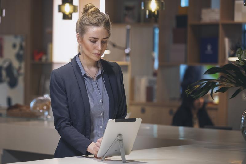 Bank hostess with tablet