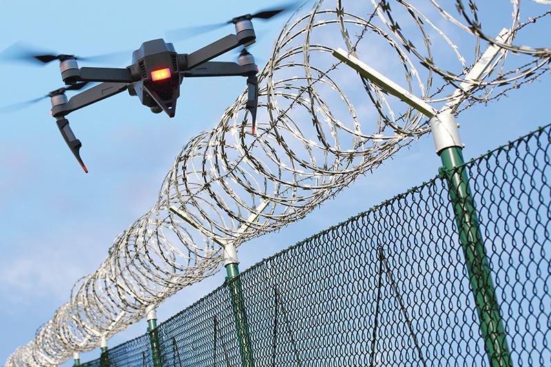 Drone passes a fence