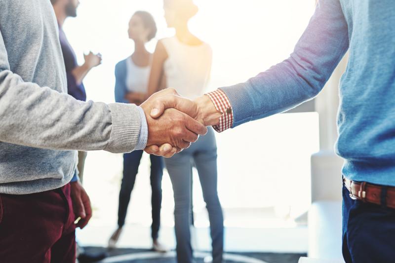 two people shaking hands