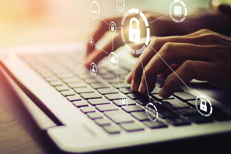 hands that are typing on a keyboard