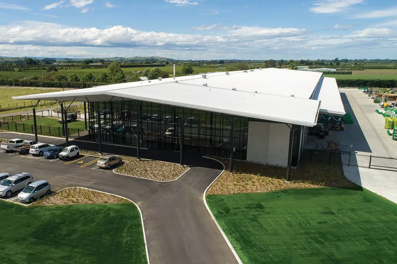 Hustler headquarter office building exterior with surrounding parking lot and lawns.