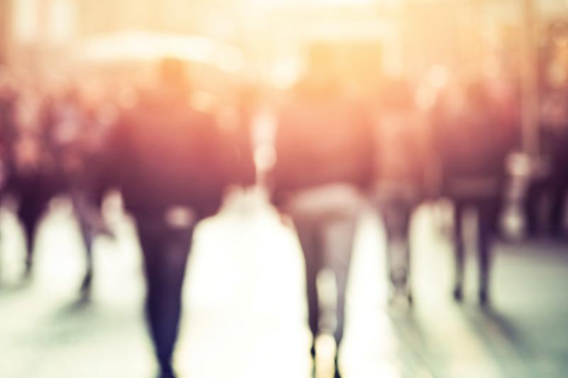 people walking in sunset light