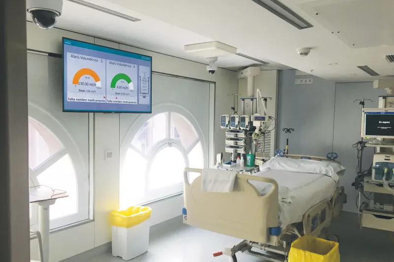 Room with hospital bed and ceiling cameras