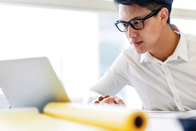 Design working on laptop