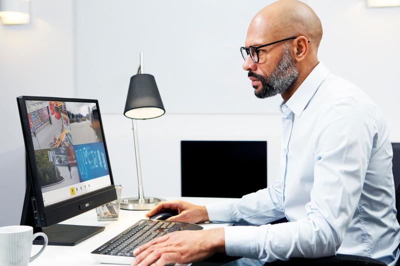 man, sitting infront of his computer screen