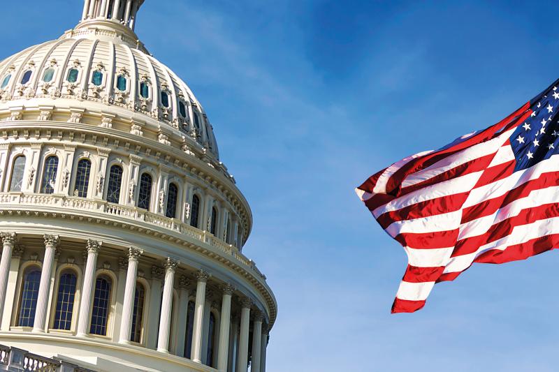 Capitol hill building with american flag