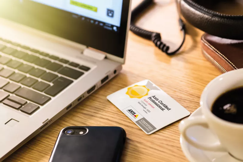 Axis certification card at a workstation