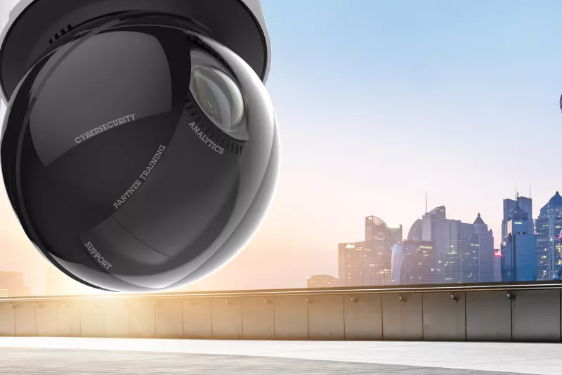 Network camera from Axis in the foreground, city skyline in the background