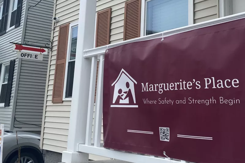 Exterior of Marguerite's Place with Sign