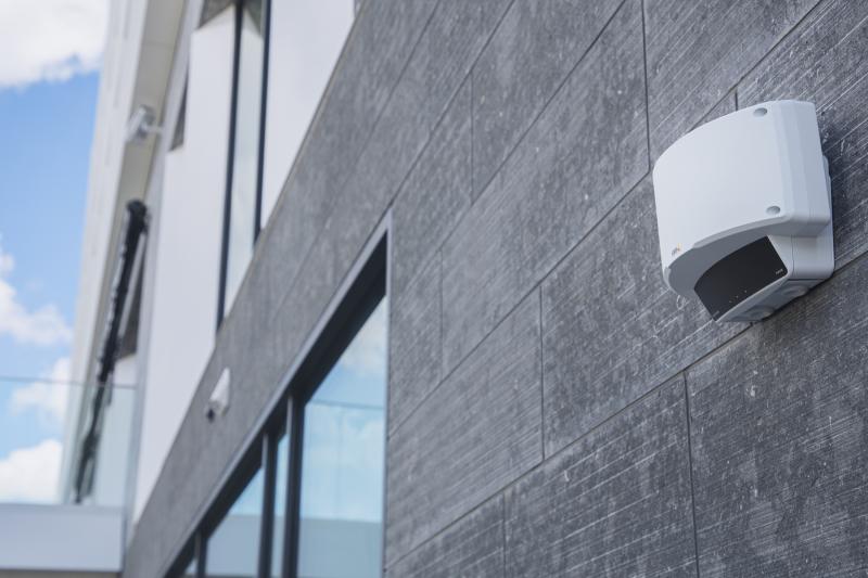 Grey wall with windows, camera mounted outside