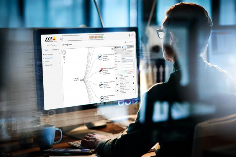 person sitting by the computer screen