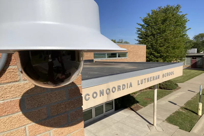 P3907 in foreground with Concordia Lutheran School exterior in background