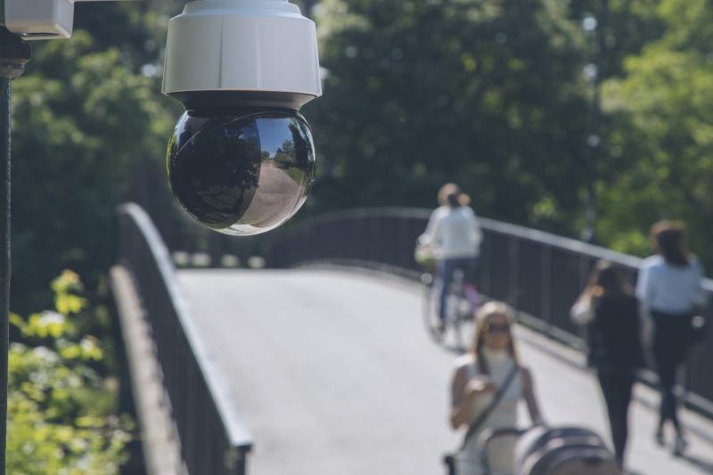 Axis camera over a bridge in a park.