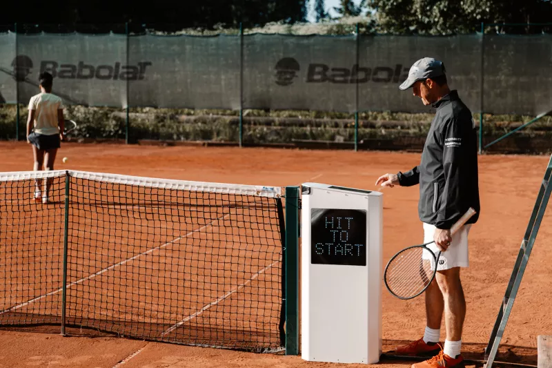 Tennis player starts game using Zenniz solution