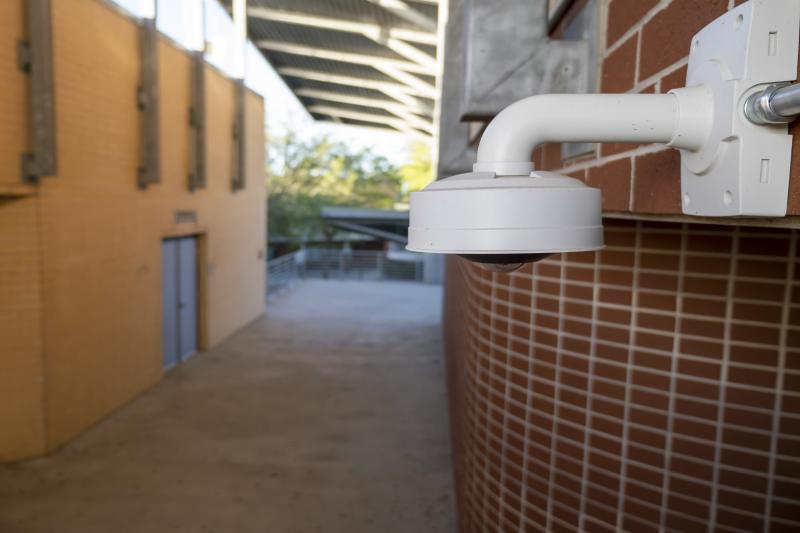 Exterior wall of school with camera in foreground