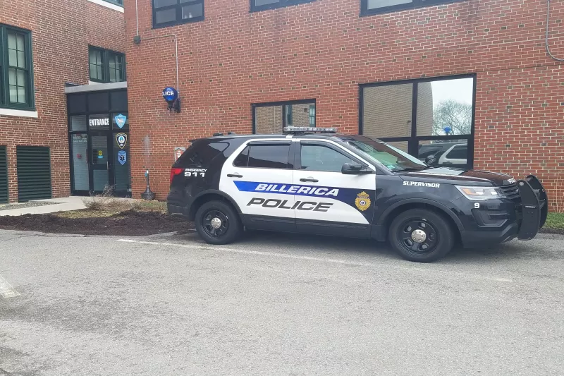 Exterior of Billerica, MA police department with police car