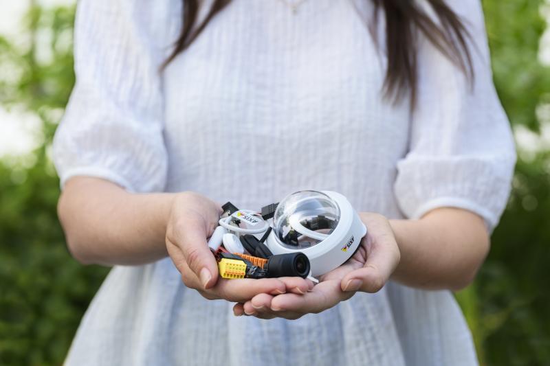 Girl holding Axis product parts