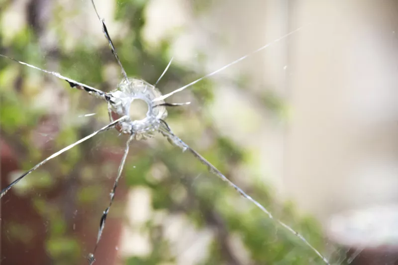 Broken glass window bullethole
