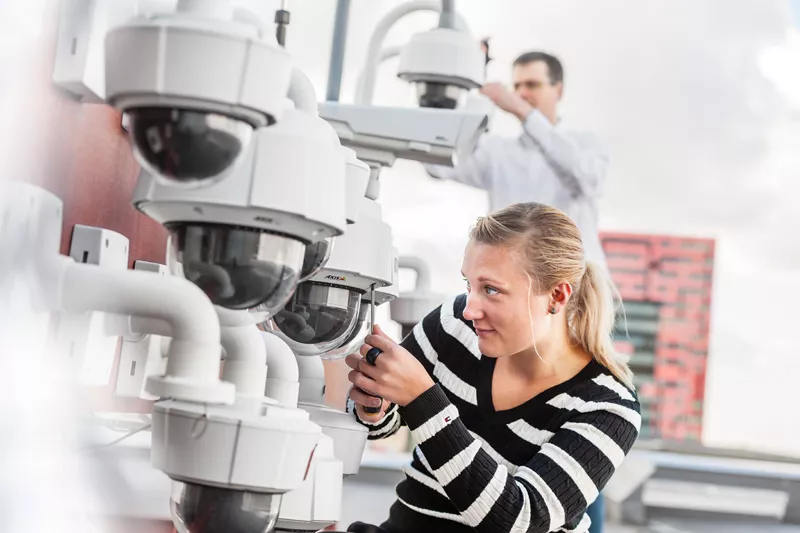 Woman installing camera