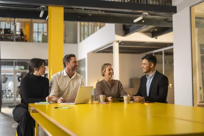 CPP group discussing by high desk