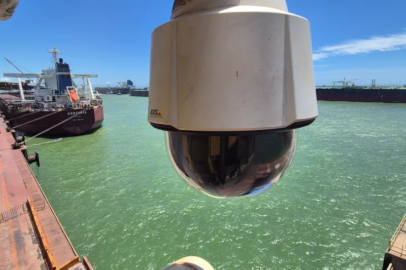 Camera in foreground with port in background