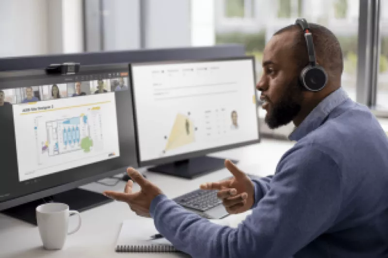 Man sitting in front of his computer taking a virtual instructor-led training.