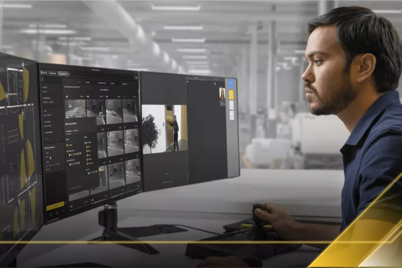 Man looking at a screen using Axis Camera Station Pro 