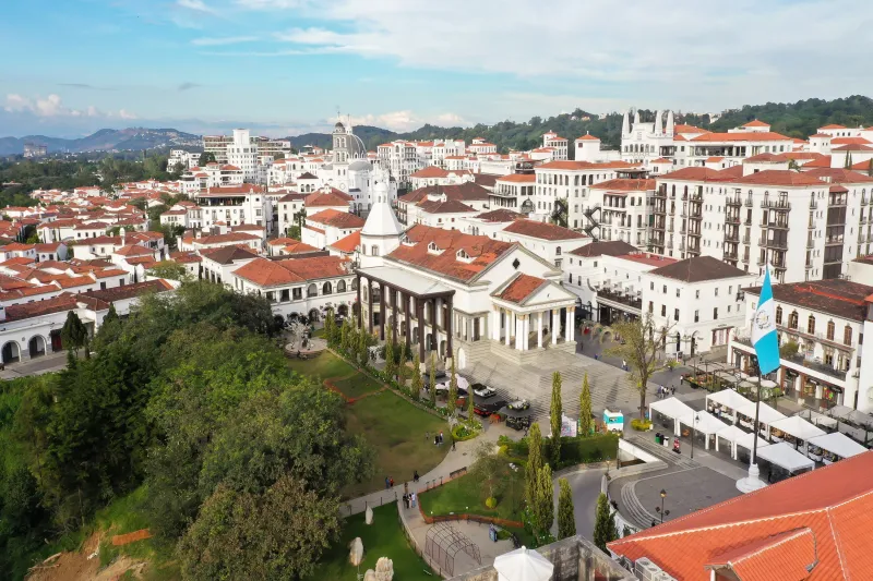Aerial view of city with flag